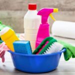 cleaning-supplies-in-a-blue-bowl-wooden-floor-back-24RA7M8-1024x673